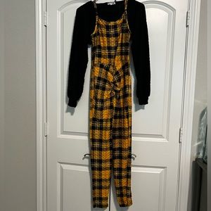 Large yellow and black one piece body suit with a black shirt (half-shirt).